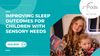 Two young girls in pajamas reading a book, promoting better sleep outcomes for children with sensory needs.